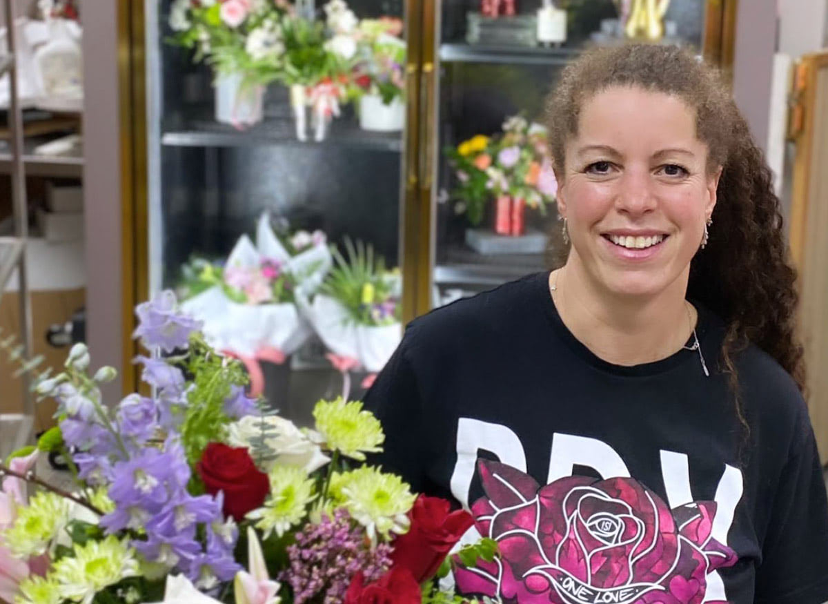 Browsing the wares of our flower cooler with the Wishing Well's owner, Selena Ross